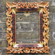 A mirror frame in the German renaissance style.  Limewood, Eucalyptus and oil gilding.
